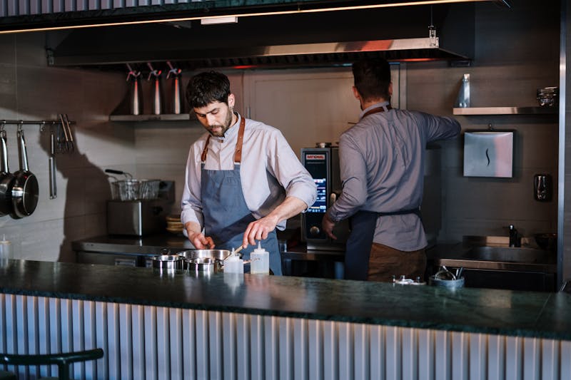 Starbird chicken team members working together in the kitchen